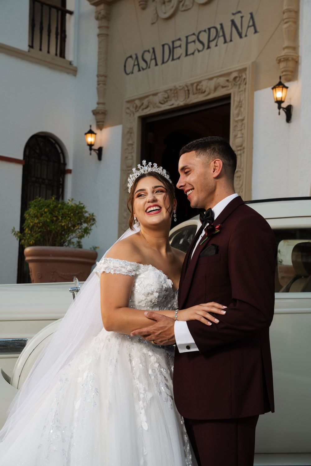 A joyful wedding moment captured outside the historic Casa de España building.