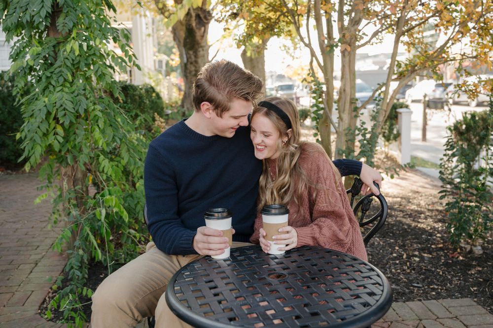 A couple enjoying coffee together for engagement photos