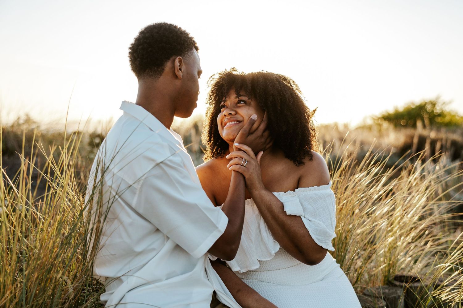 couple sitting at alameda beach near oakland staring into each other's eyes romantically - san francisco engagement photos, east bay photos