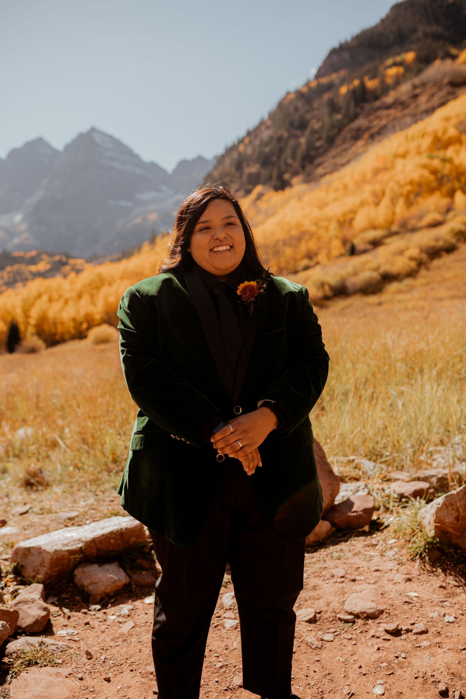 Person standing in front of a mountain