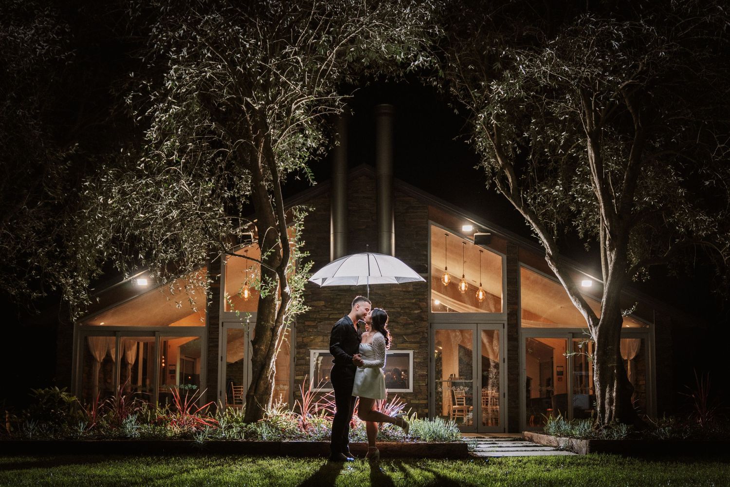 Markovina wedding couple kissing night shot with flash romantic