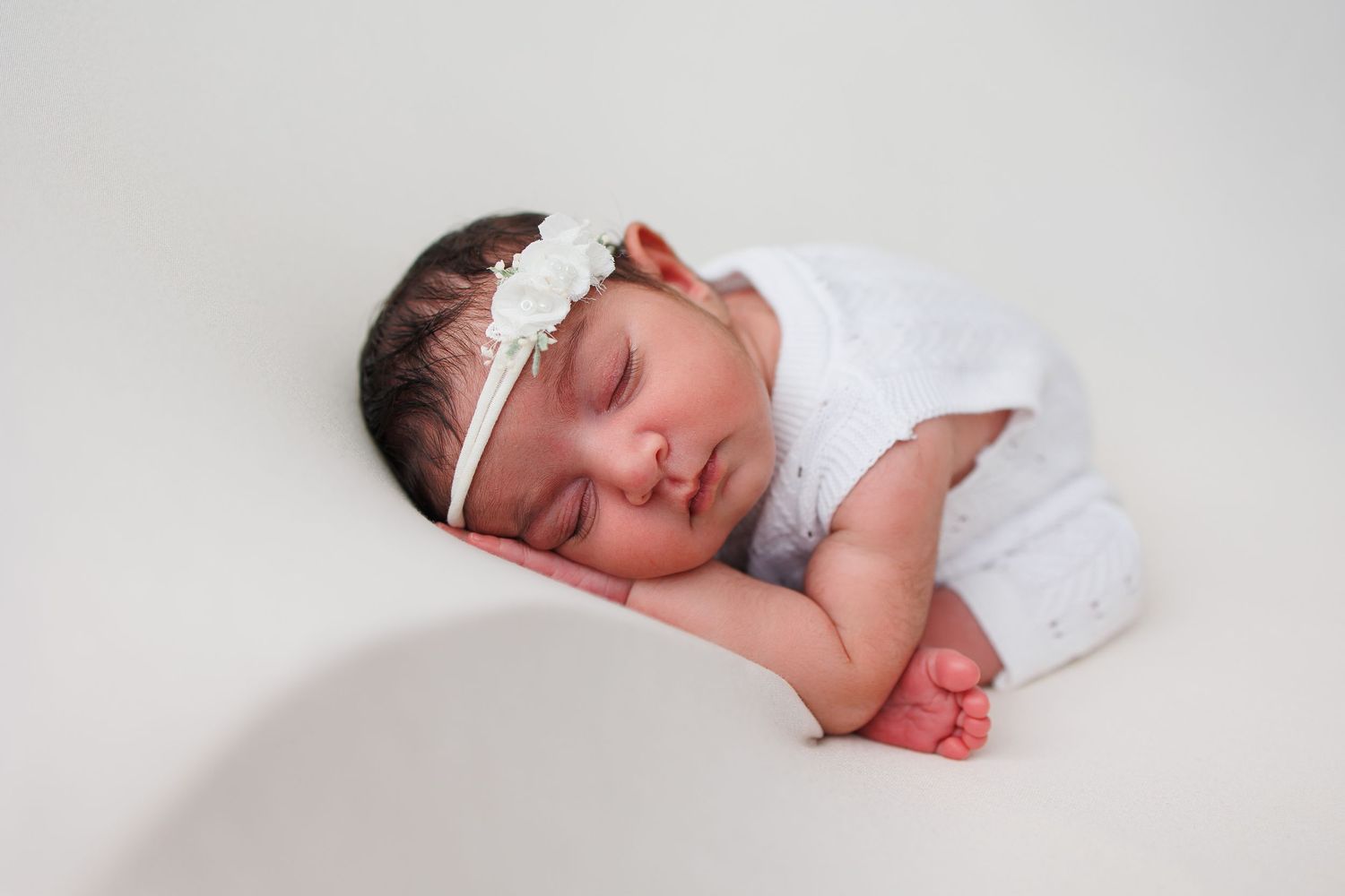 newborn baby photography baby girl curly pose Tameside