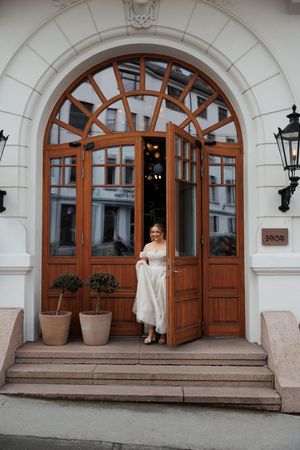 Beautiful arched doorways with wooden frames and ornate stonework create an elegant entrance to a historic building.