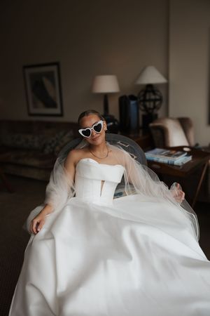 A series of artistic wedding dress detail shots with sunglasses showcase a modern bride's elegant style and accessories.