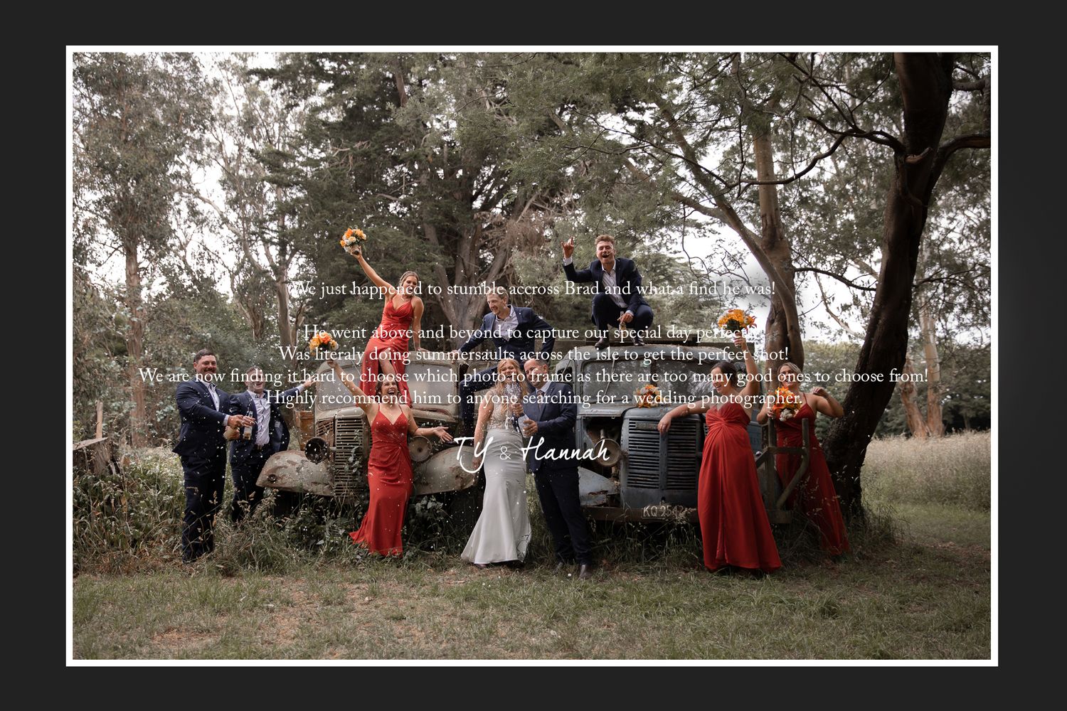 A wedding party in red and white attire poses together outdoors.