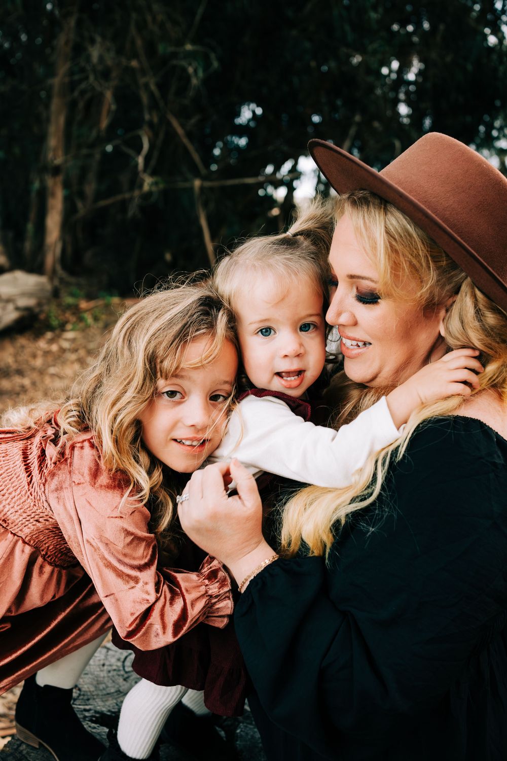 Mom holding her two girls, facing the camera, Santa Maria, CA