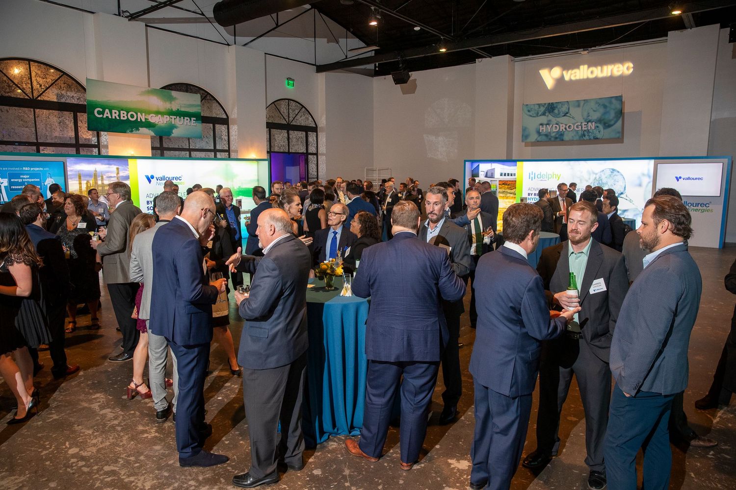 Business professionals networking at a corporate conference event.