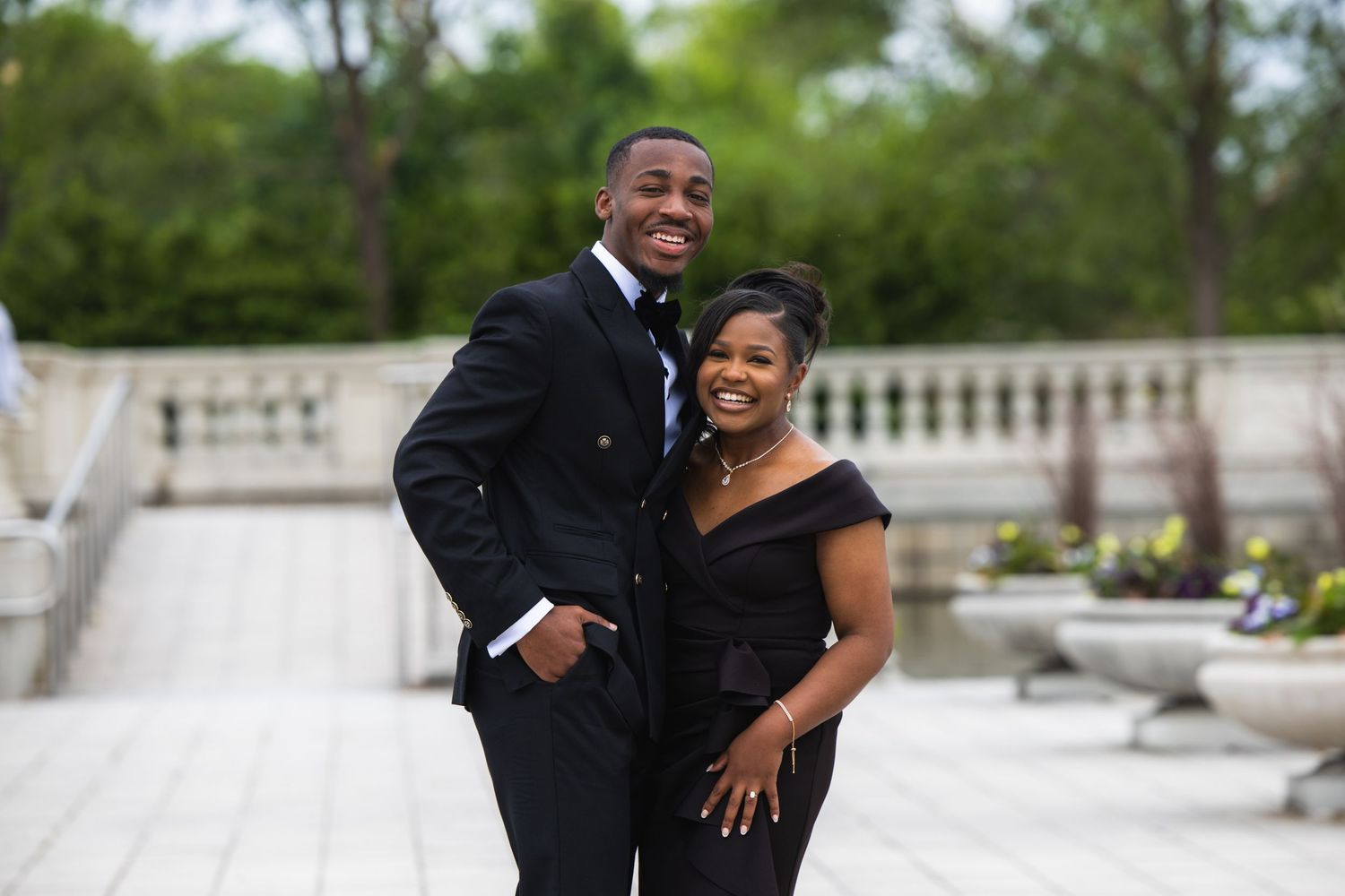 A St. Louis couple getting their engagement photos taken by Carly Scaduto Photography in Forest Park.