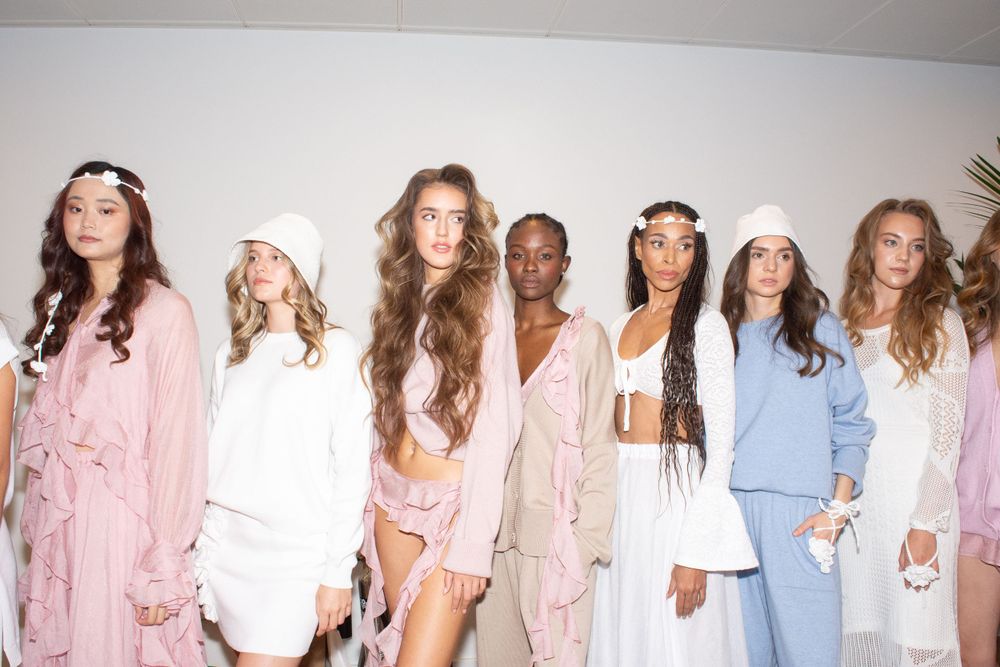 Female models posing during a Ukrainian fashion show in London, UK