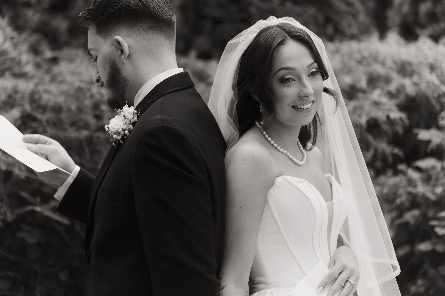 Outdoor black and white Bride and Groom First Look Photos