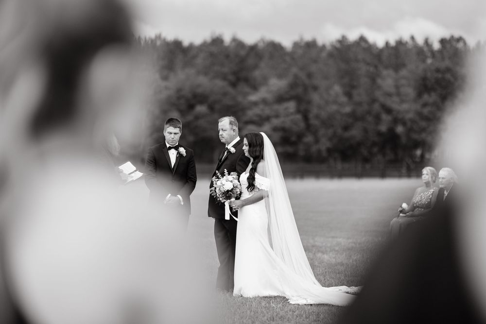 Black and white wedding photo collage showing romantic moments between newlyweds in an outdoor garden setting.