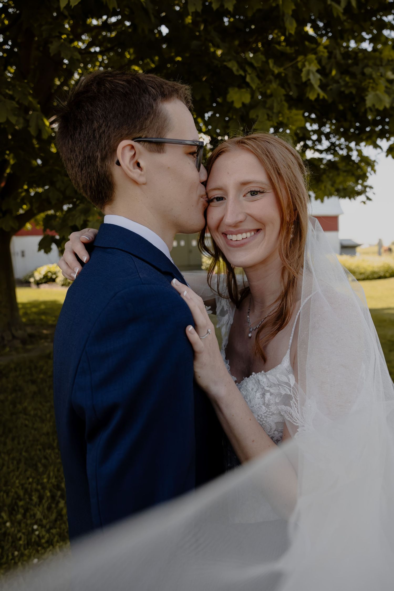 Intimate black and white wedding portrait of couple sharing tender moment. in Saukville, WI  with Essence Rose Photography.