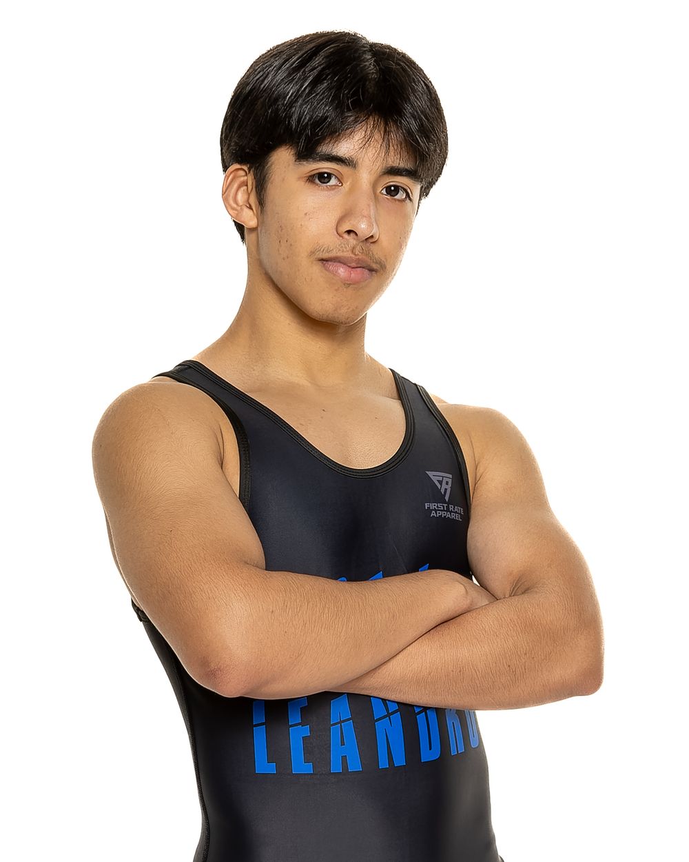 Athlete in black wrestling singlet with blue Leander text poses with crossed arms.