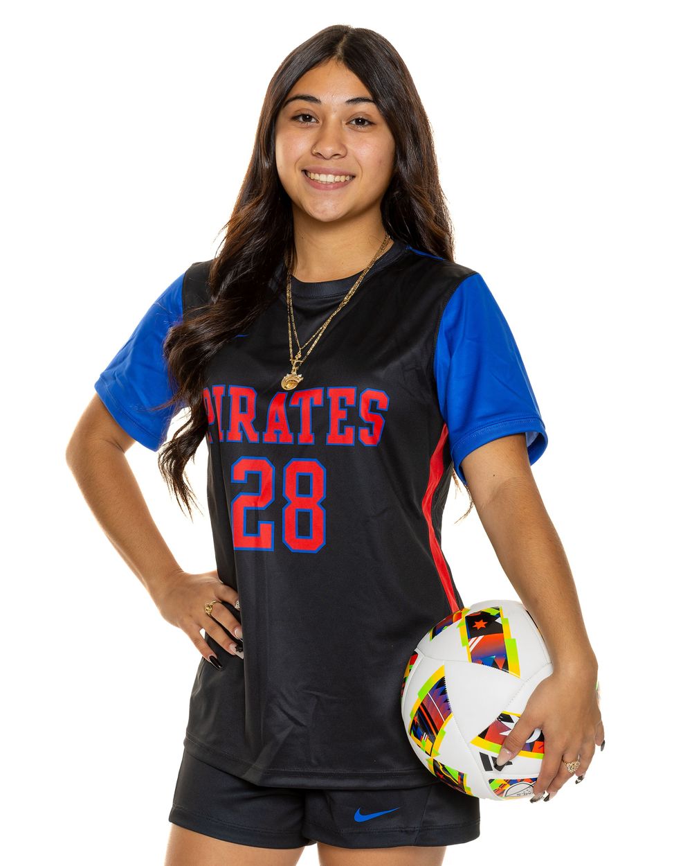 Student athlete in Pirates uniform number 28 poses with soccer ball.