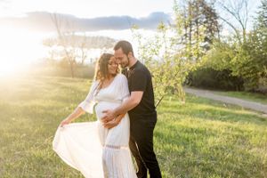 A romantic sunset photo session in a natural outdoor setting with mountain views.