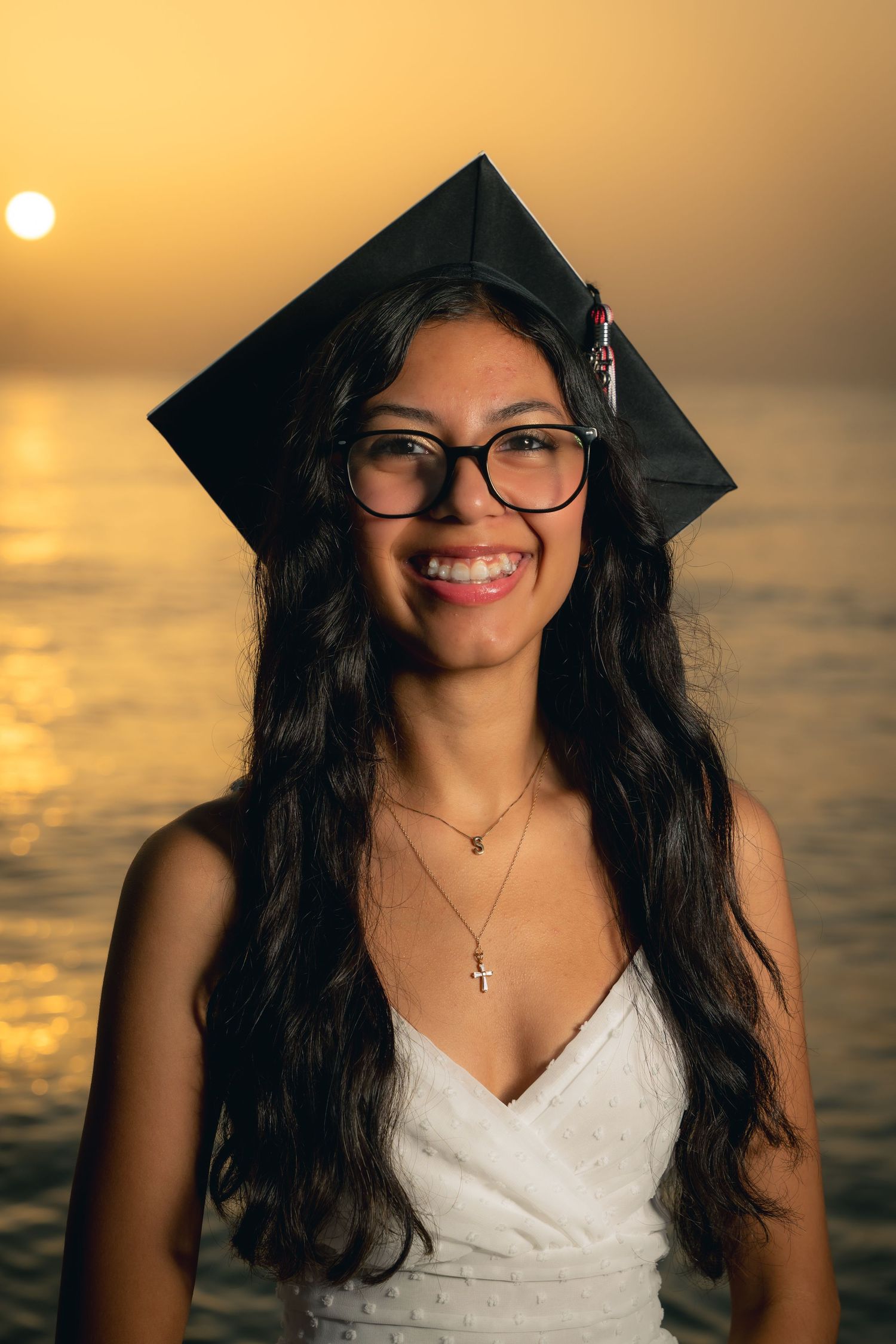 A series of photos at sunset shows someone in a white dress and glasses posing against a golden sky backdrop.