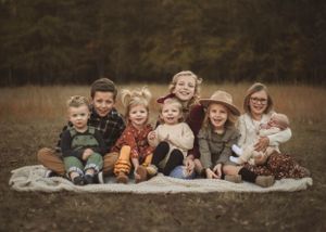 Norman newborn session with big sister kisses and cozy vibes