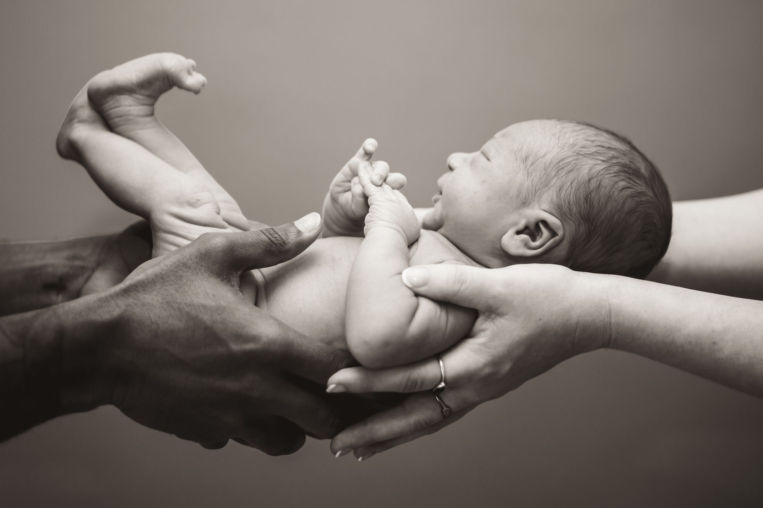 Black and white newborn portrait showing timeless connection in Nichols Hills