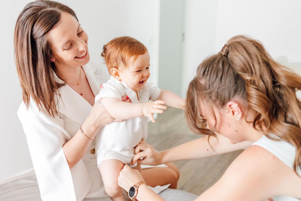 A tender care moment captured indoors with white decor.