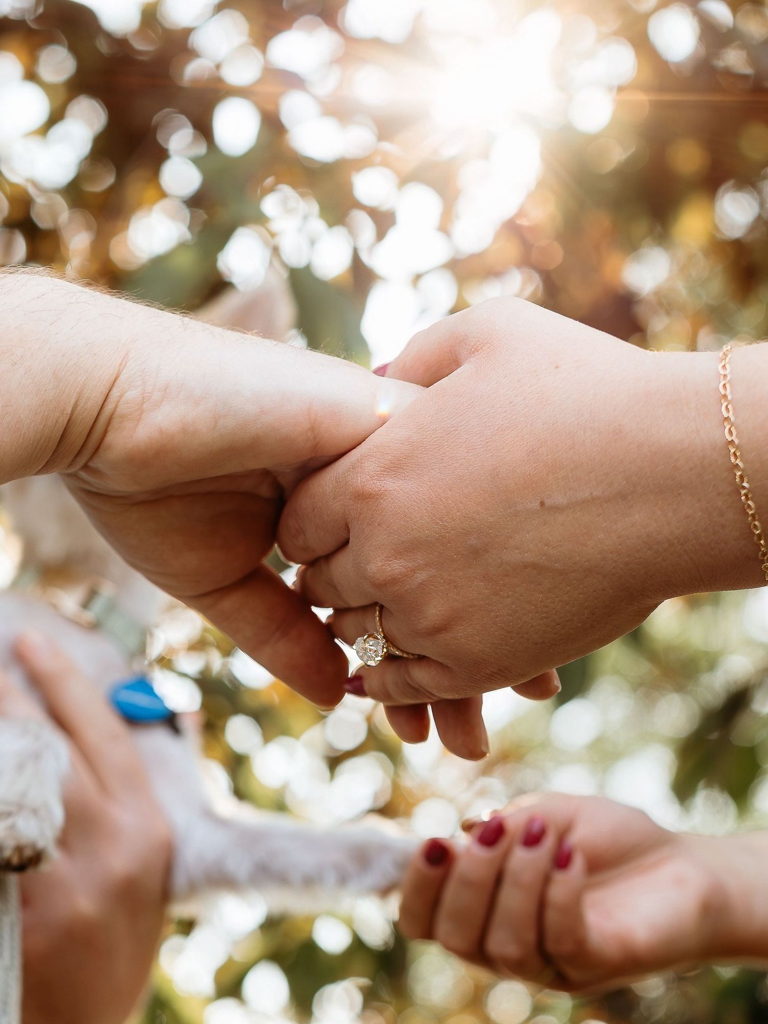 Three sequential photos showing hands reaching towards each other against a soft blurred bokeh background.