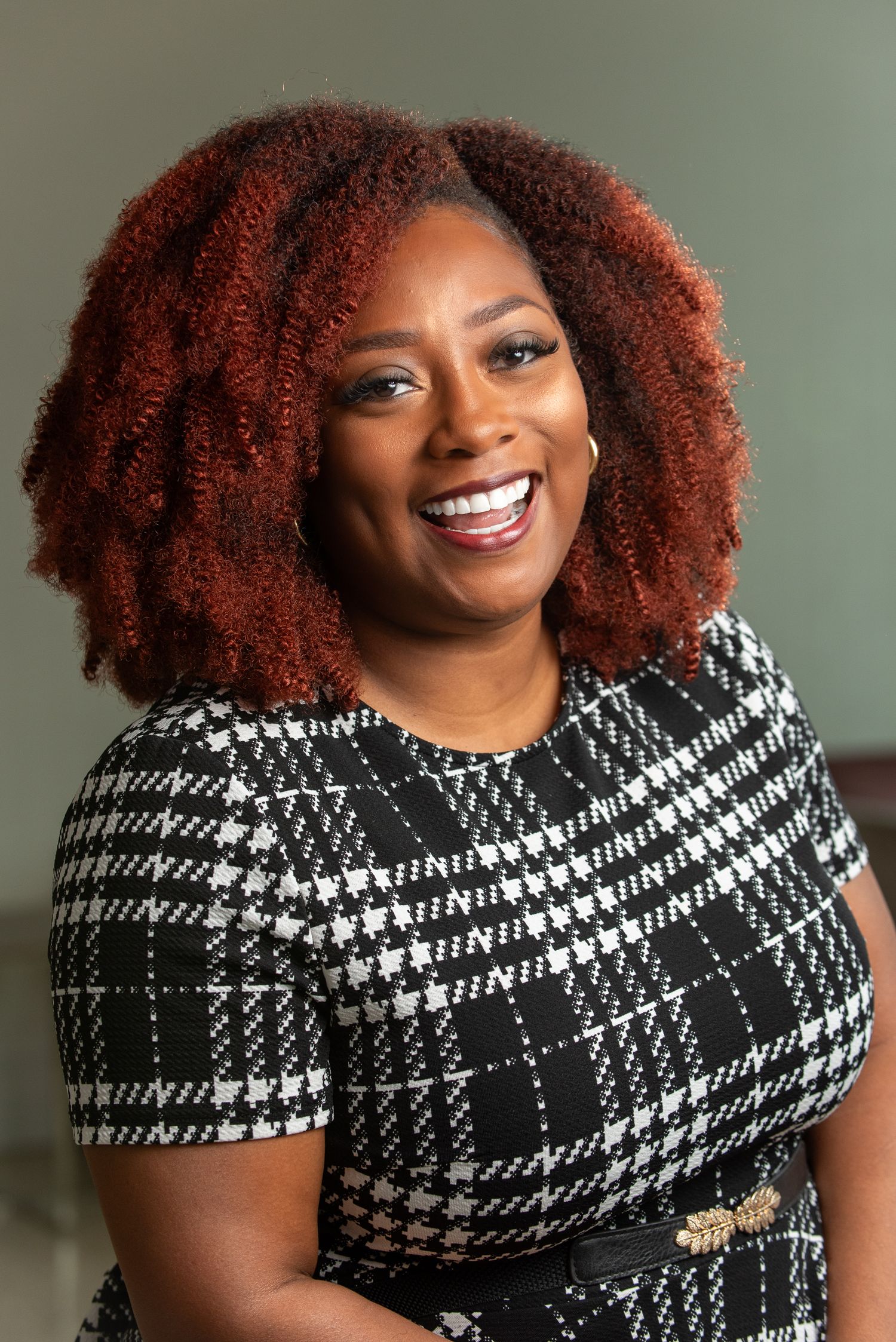 A portrait of a smiling woman.