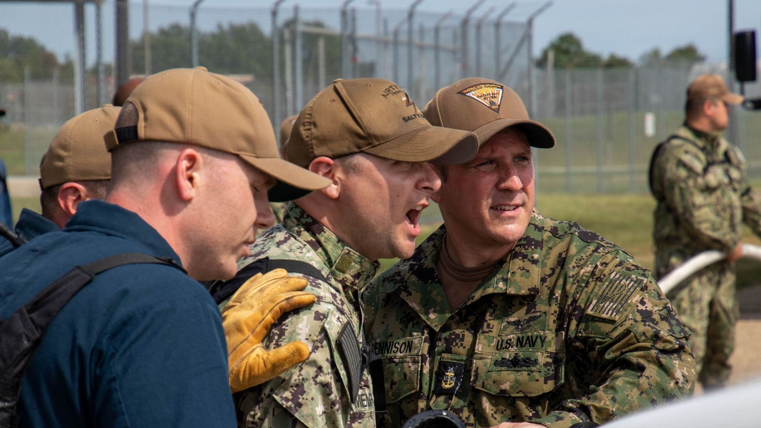 Documentary style image capturing the grit, communication, and leadership of Naval aviation Chiefs during a base training