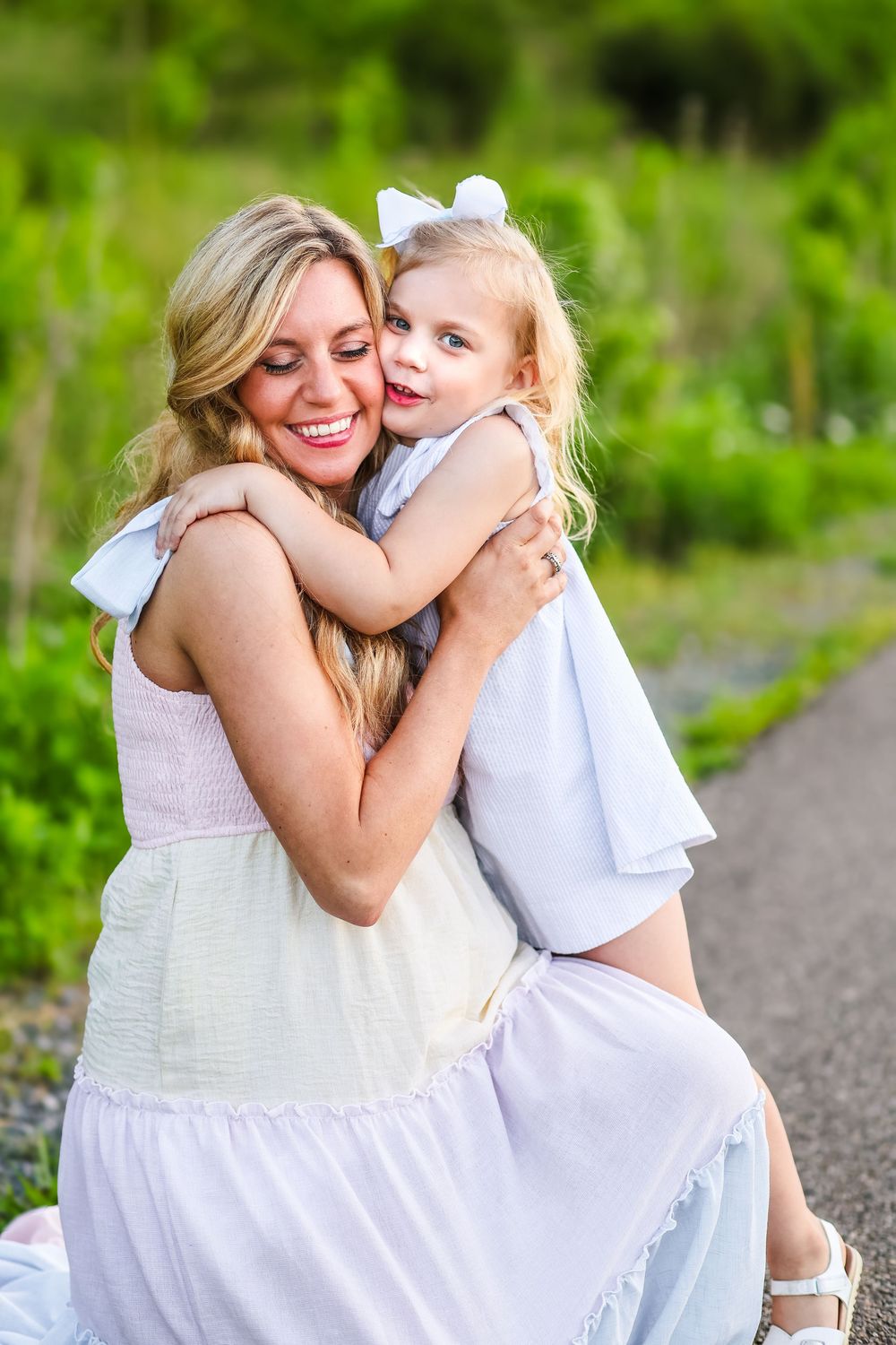 A mother holding her daughter.