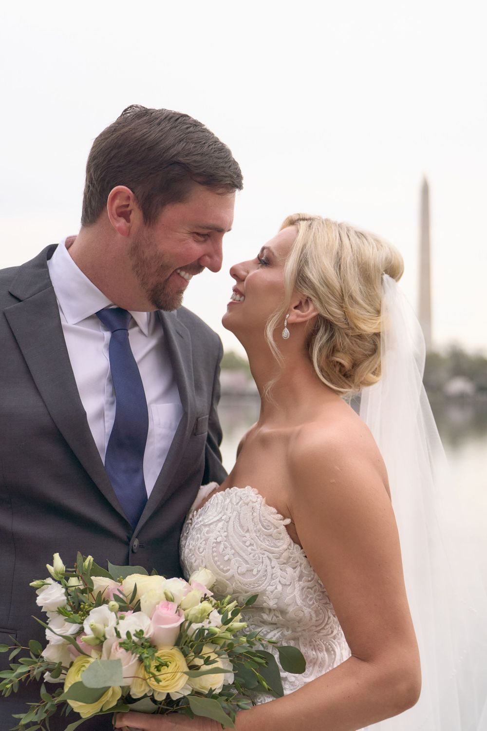 A newlywed couple shares intimate moments in a series of romantic beach wedding photos with soft lighting.