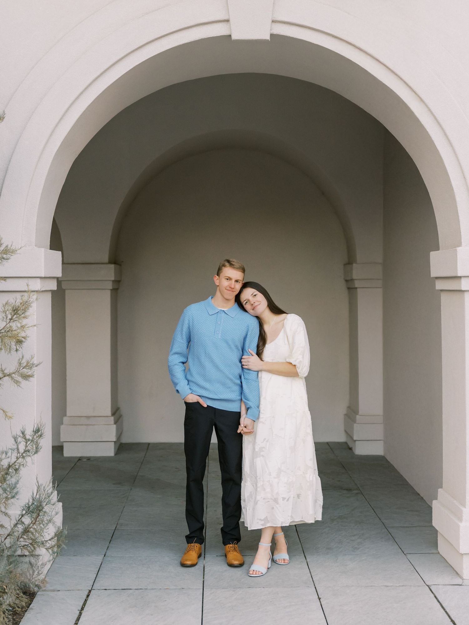 A sweet embrace captured in casual outdoor portrait session.