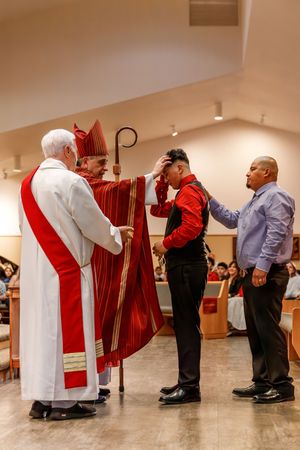 A sequence of photos showing religious clergy members during a formal blessing or ritual ceremony in a church setting.