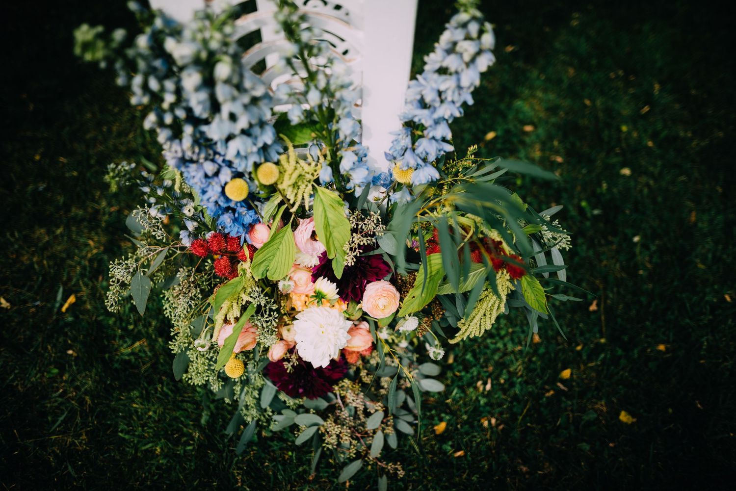 This floral arbor piece sets the tone for Leighs's wedding. Her backyard was so intimate and colorful.