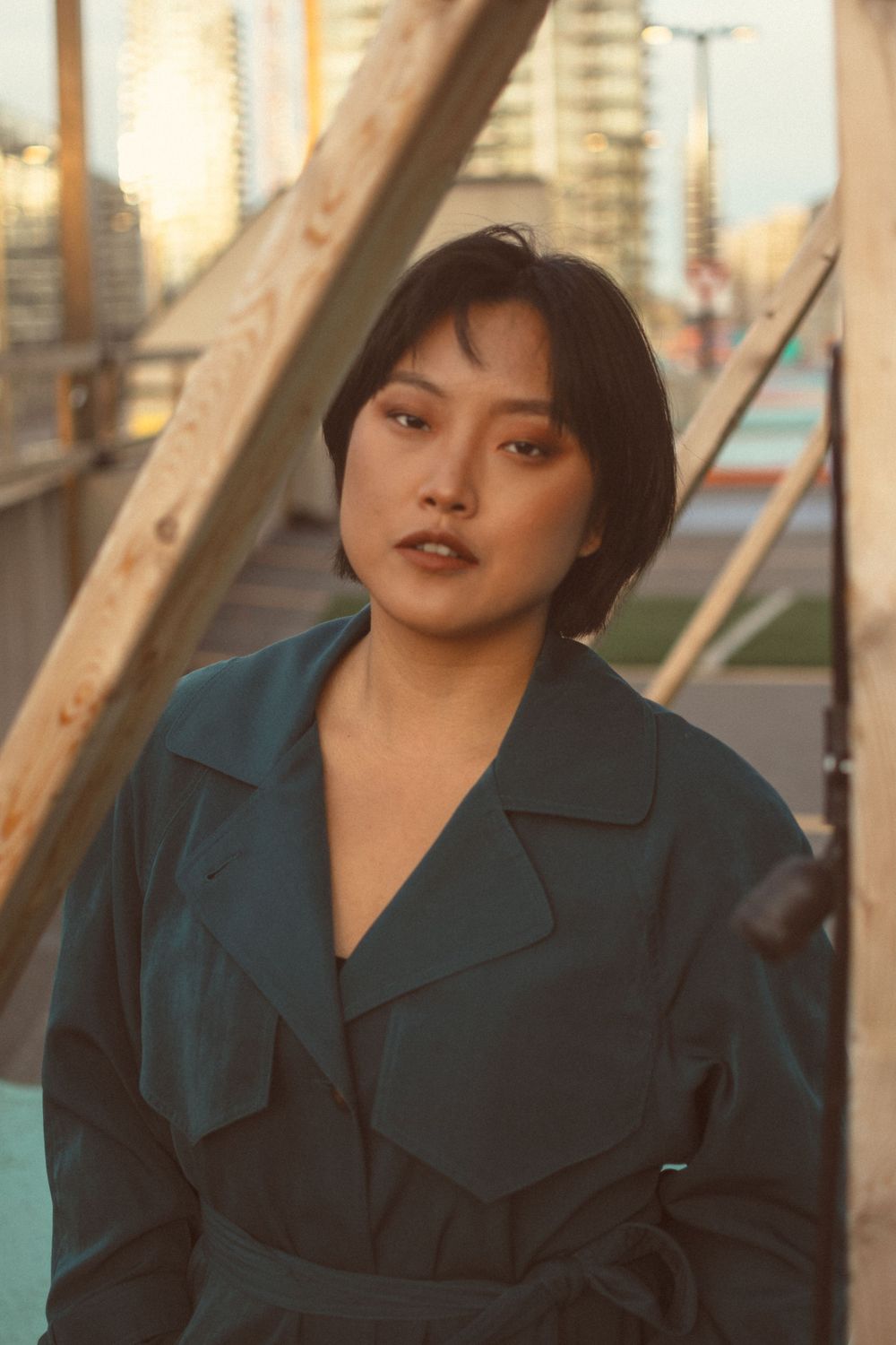 Portrait against urban backdrop at golden hour.