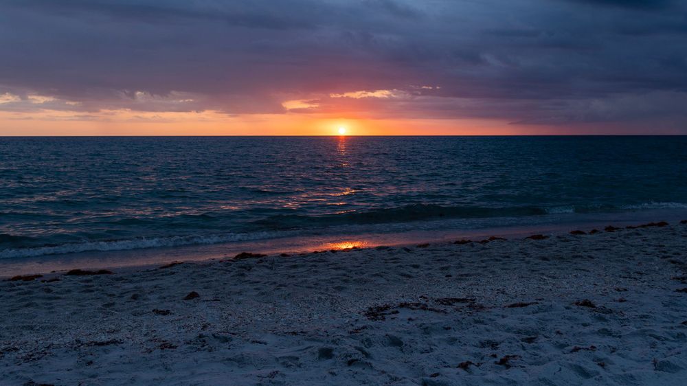 A sunset over a beach