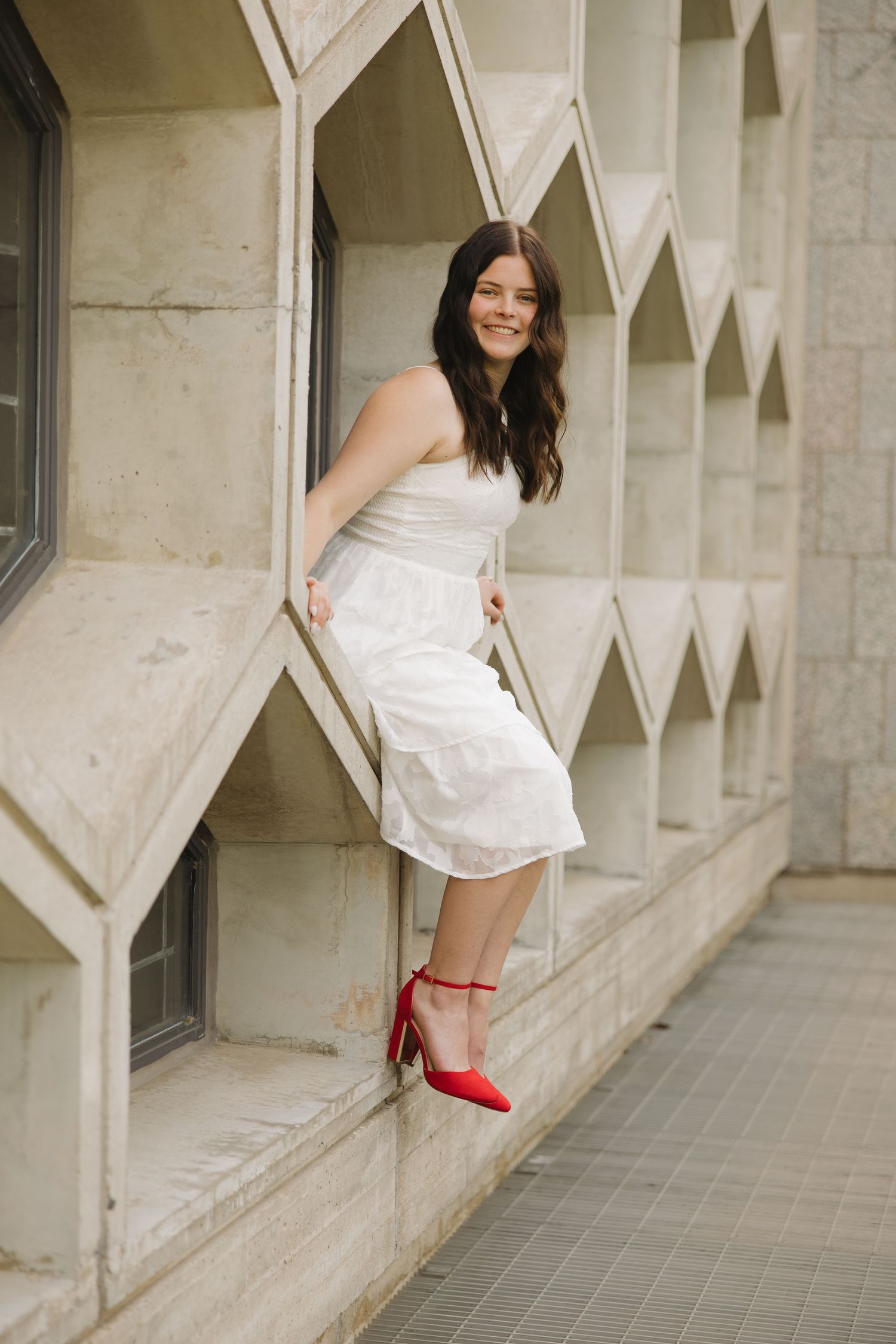 A sequence of outdoor maternity photos showing a woman in a white flowing dress during golden hour.