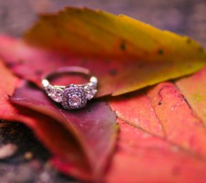 Engagement ring shot on a fall leaf