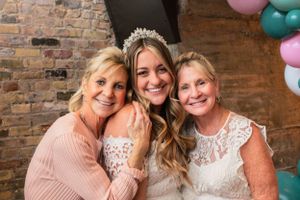 Bride and family face camera for bridal shower photo in third ward milwaukee restaurant