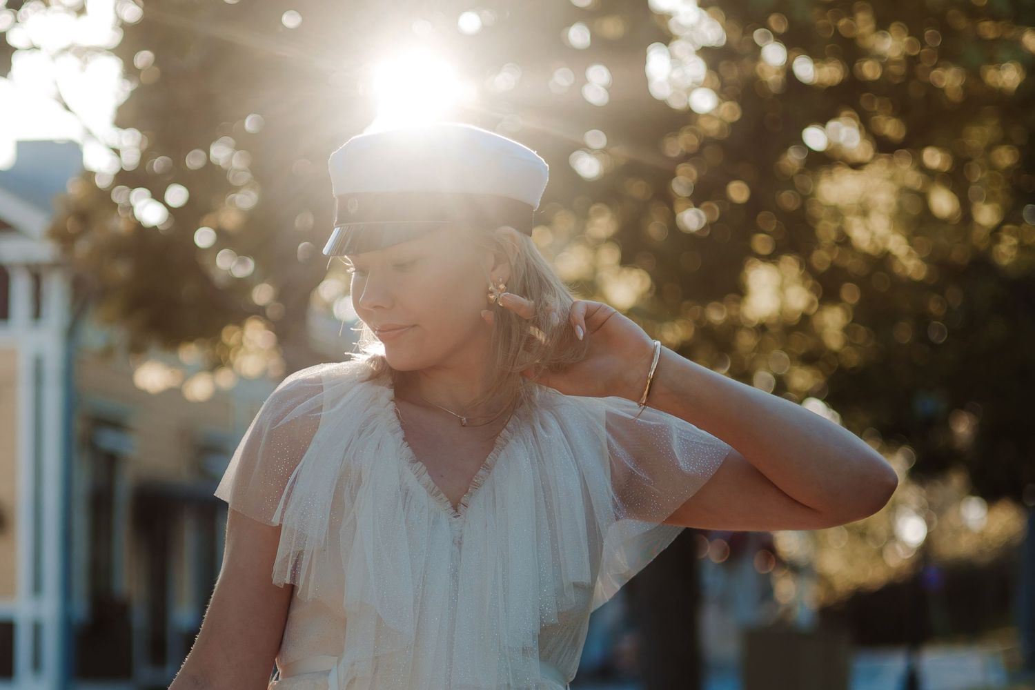 Golden sunlight streams through trees creating a dreamy backlit scene.