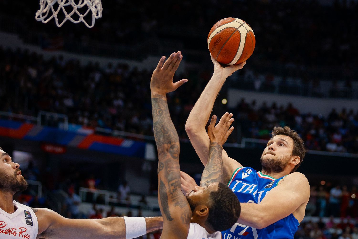 Danilo Gallinari of Italy shoots the ball against Puerto Rico during the 2024 FIBA Olympic Qualifying Tournament.