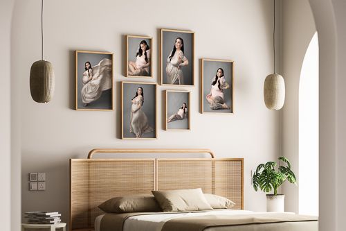 Modern interior design with framed photographs on white walls and minimalist wooden furniture in a bright room.