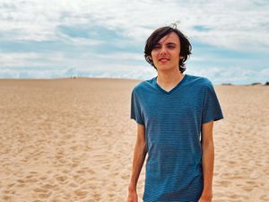 Ethan enjoying the sand dunes while on our family camping trip, captured by Urso Photography.