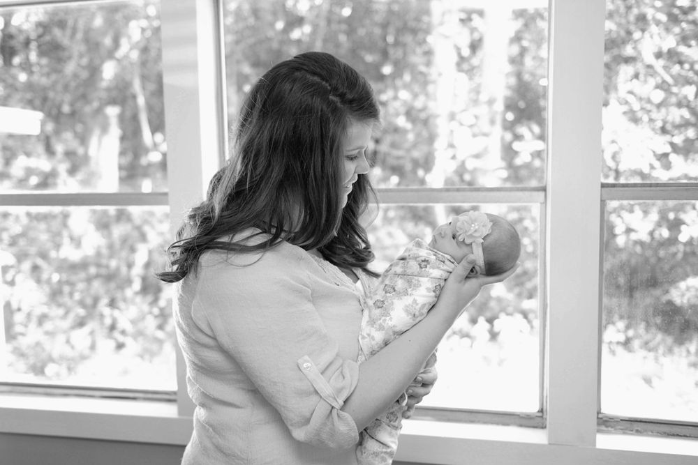 Bright sunlit room with large windows creates natural backdrop for indoor photography.
