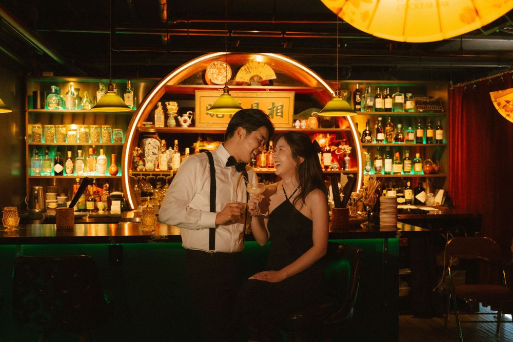 A romantic scene at a vintage bar with warm lighting and intimate atmosphere.