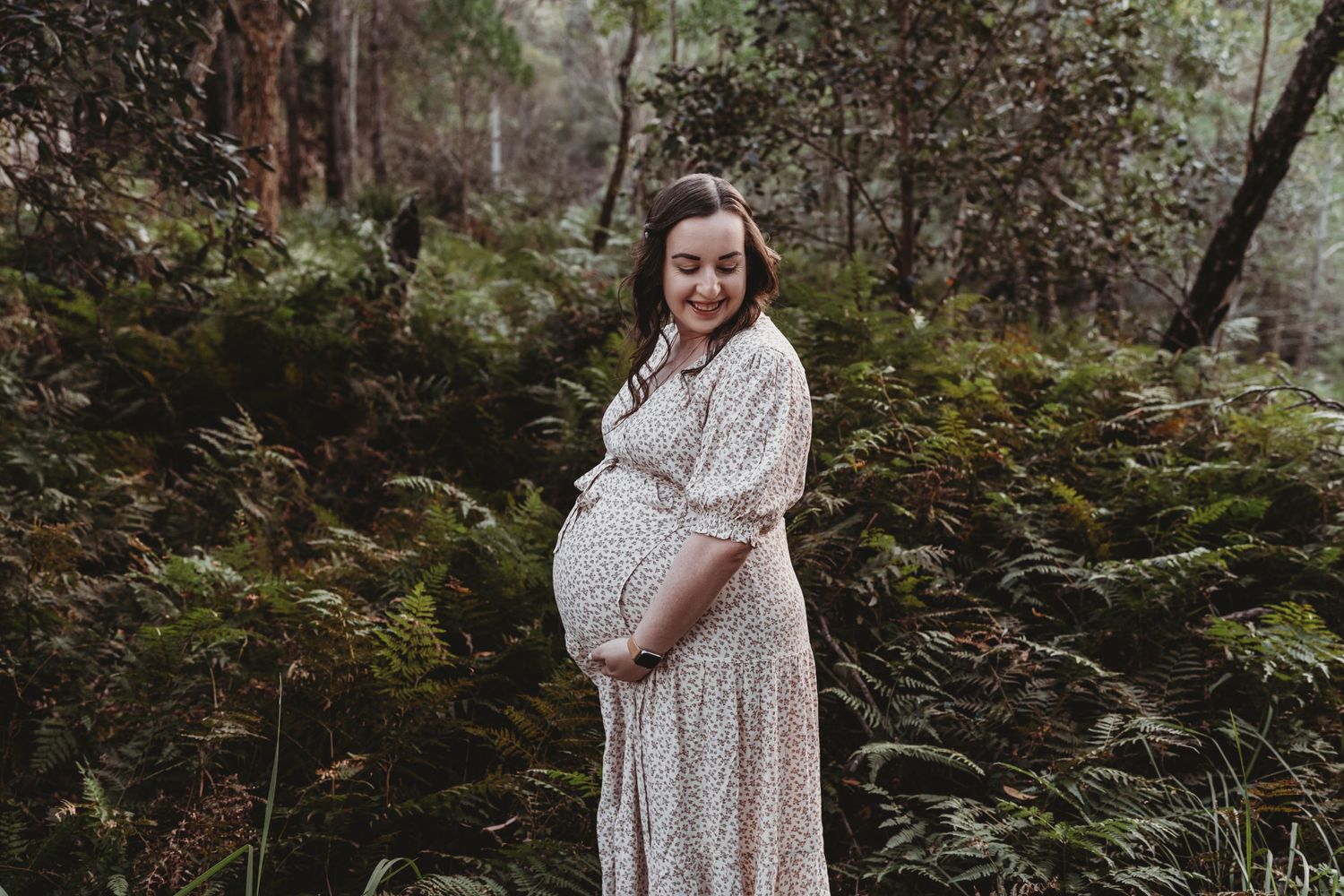 Mum to be holding bump during maternity session