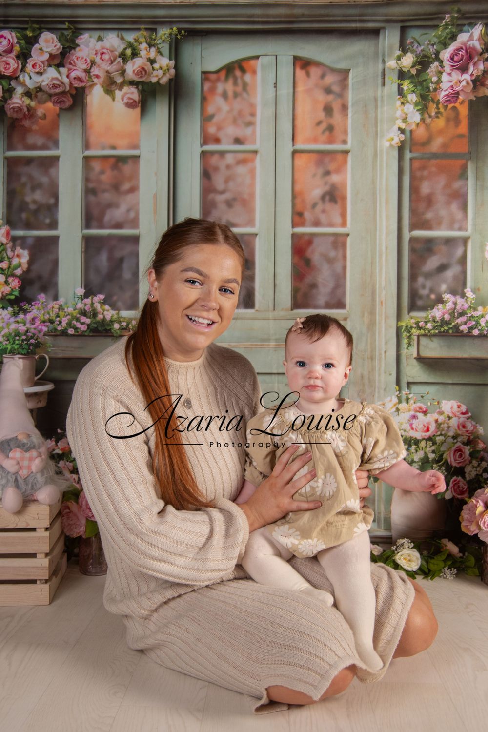Cozy indoor portrait setup with cream knits against floral window backdrop.