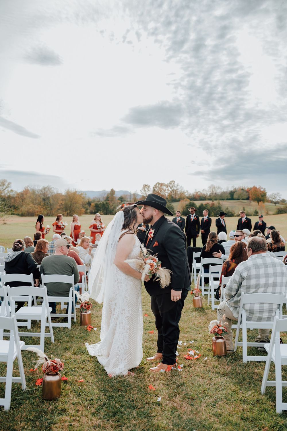 Couple celebrating western-themed wedding at rustic barn in Tennessee