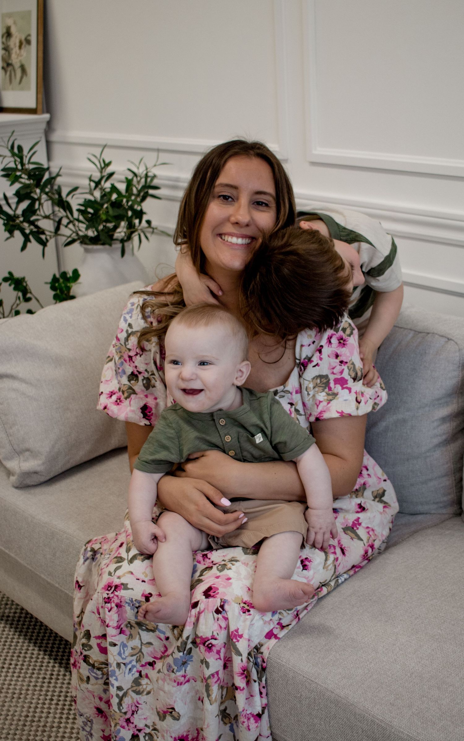 Mother with 2 boys giving cuddles