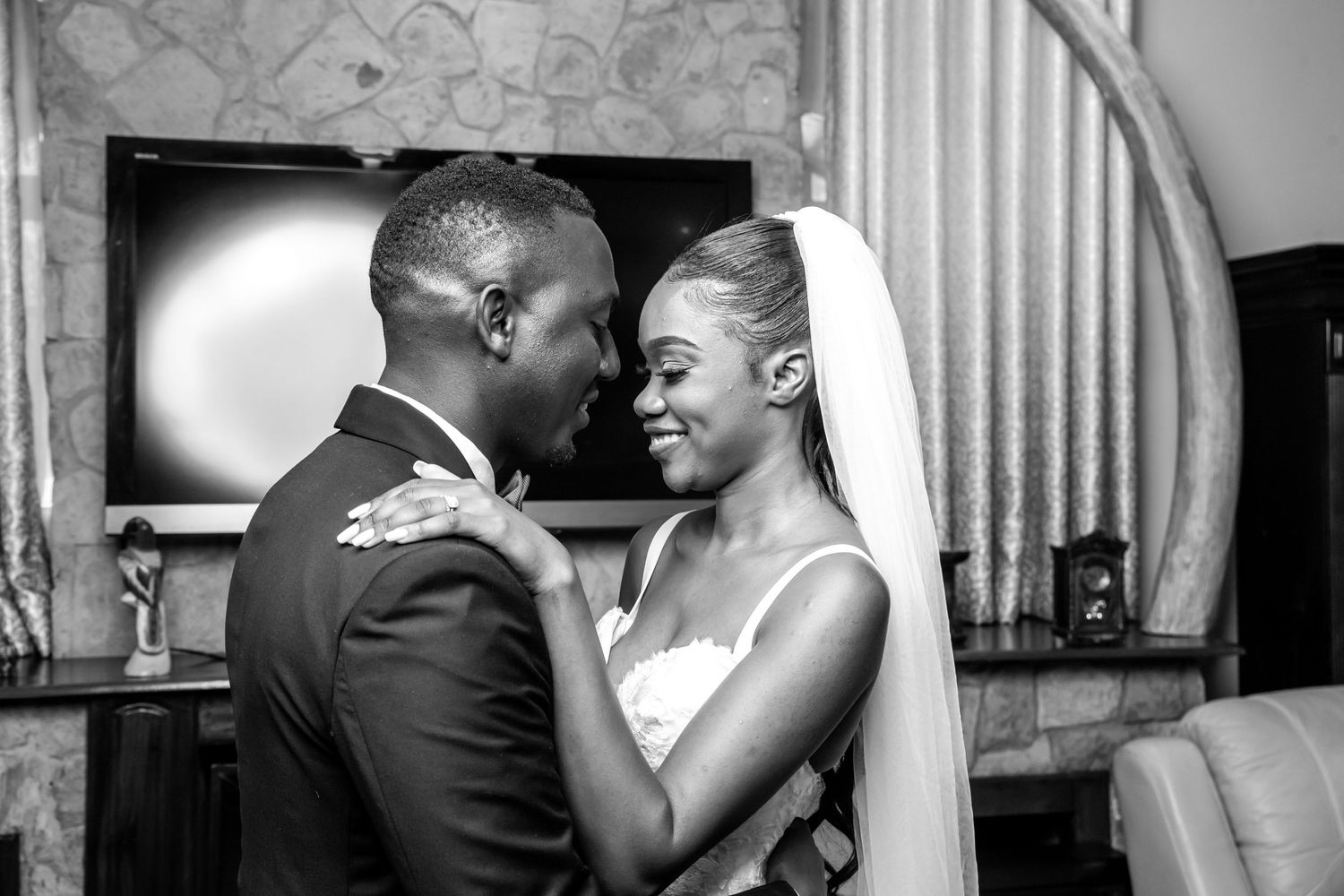 A black and white wedding photo sequence showing an intimate dance between a couple at their reception.