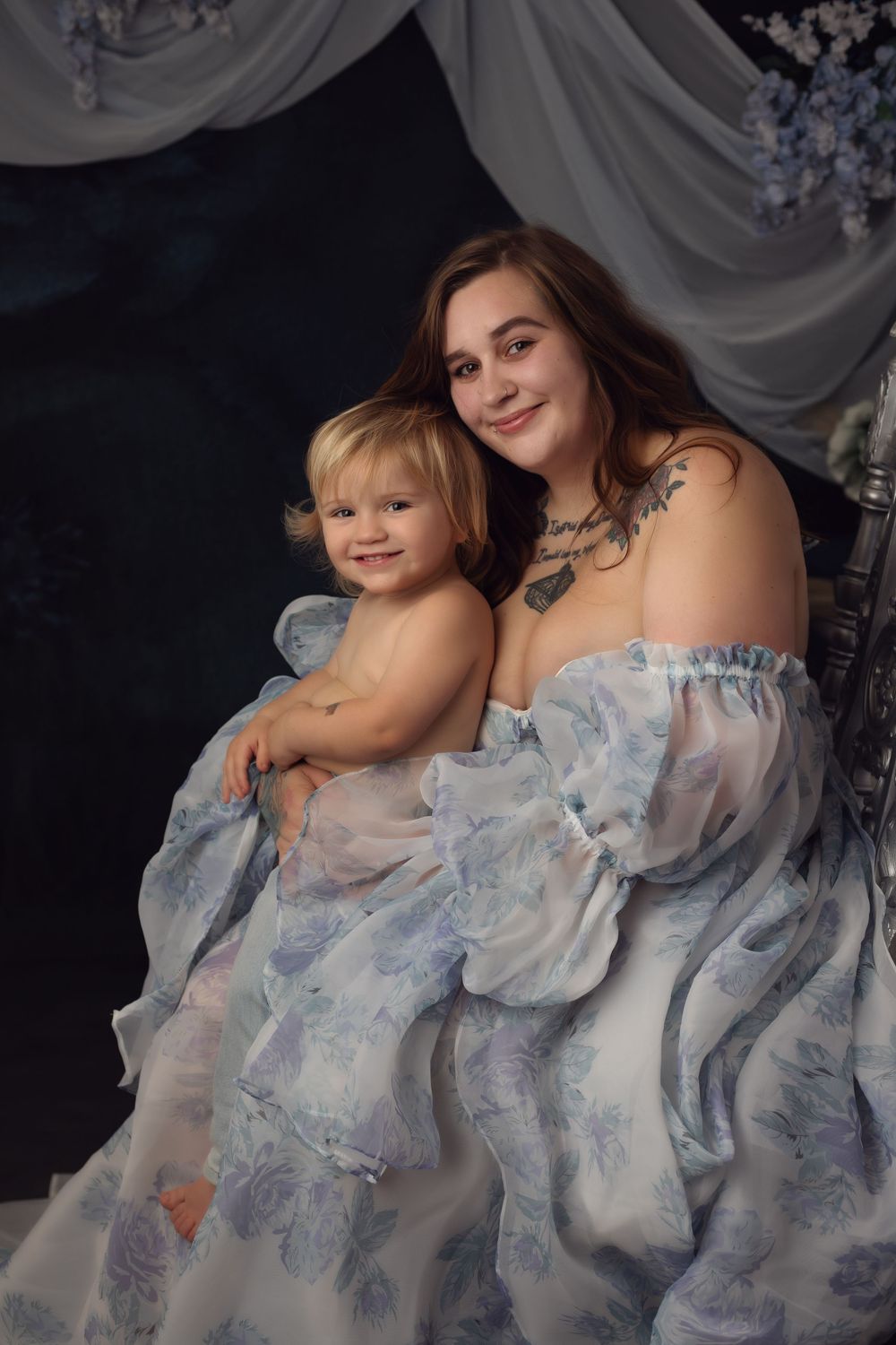 A series of dreamy portraits featuring soft blue and white floral dresses against a dark background.