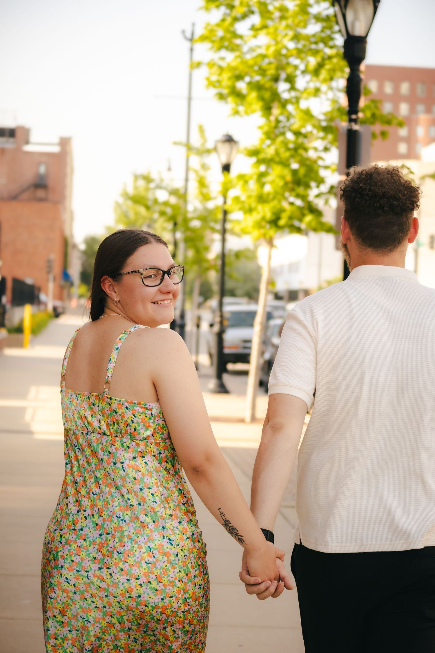 Outdoor summer engagement photos in downtown in Springfield, Illinois