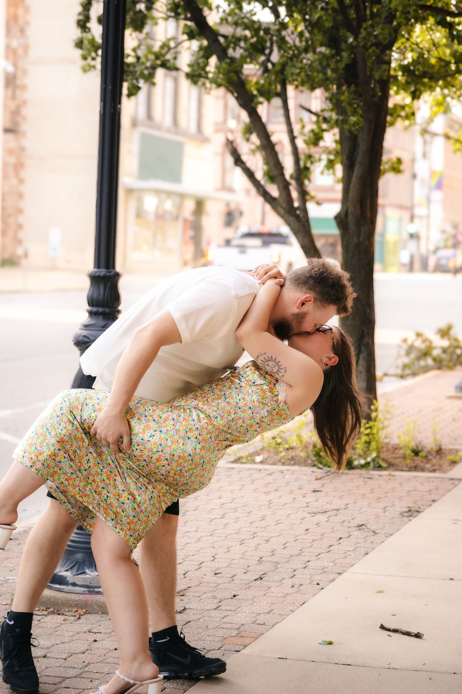 Outdoor summer engagement photos in downtown in Springfield, Illinois